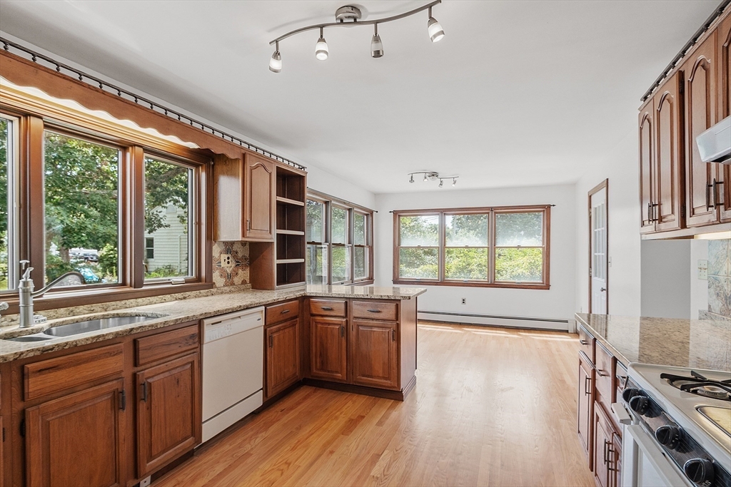 4 22nd Street Wareham, MA 02558 - Photo 14 of 22 a kitchen with stainless steel appliances a stove sink and cabinets