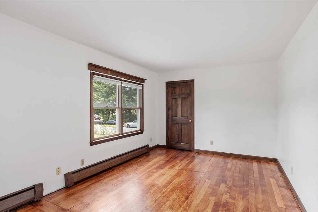 4 22nd Street Wareham, MA 02558 - Photo 17 of 22 an empty room with wooden floor and windows