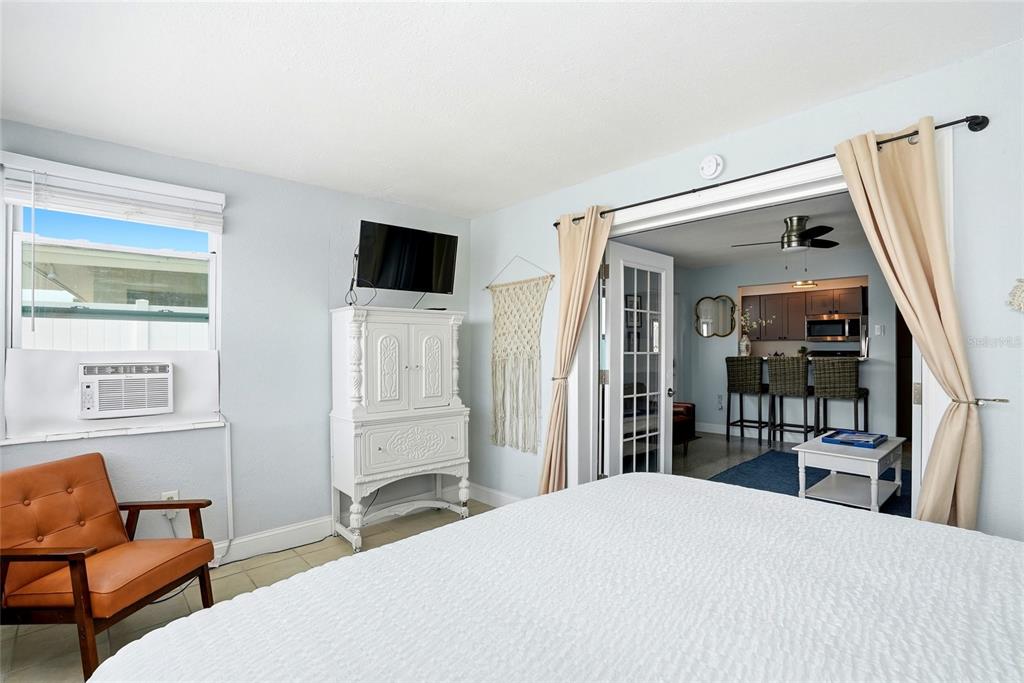 2311 Bay Boulevard Indian Rocks Beach, FL 33785 - Photo 22 of 80 a bedroom with a bed and a flat screen tv
