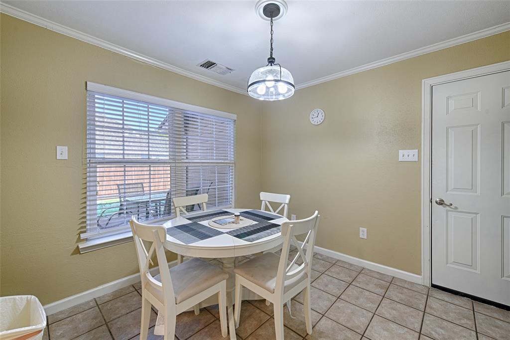 15632 Moondust Drive Dallas, TX 75248 - Photo 20 of 36 a view of a dining room with furniture window and wooden floor