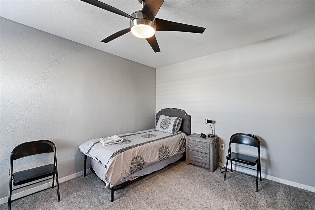 15632 Moondust Drive Dallas, TX 75248 - Photo 29 of 36 Carpeted bedroom featuring ceiling fan and baseboards