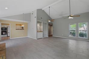 15632 Moondust Drive Dallas, TX 75248 - Photo 7 of 36 an empty room with windows and ceiling fan