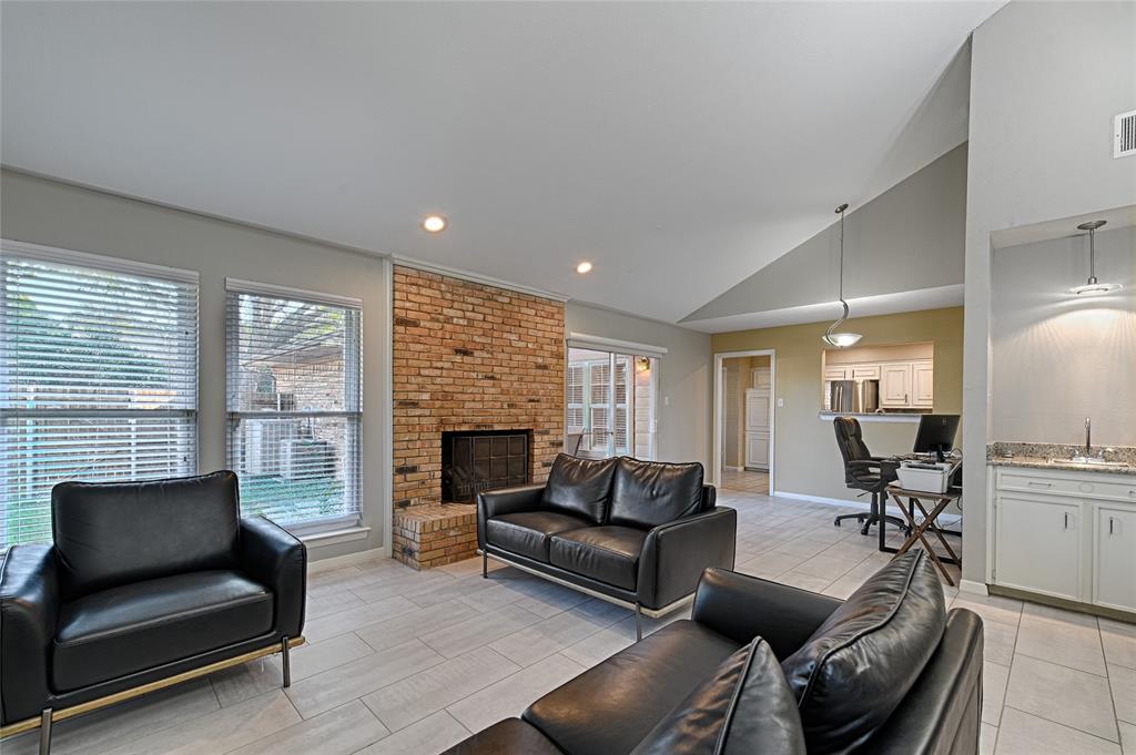 15632 Moondust Drive Dallas, TX 75248 - Photo 9 of 36 a living room with furniture and a fireplace