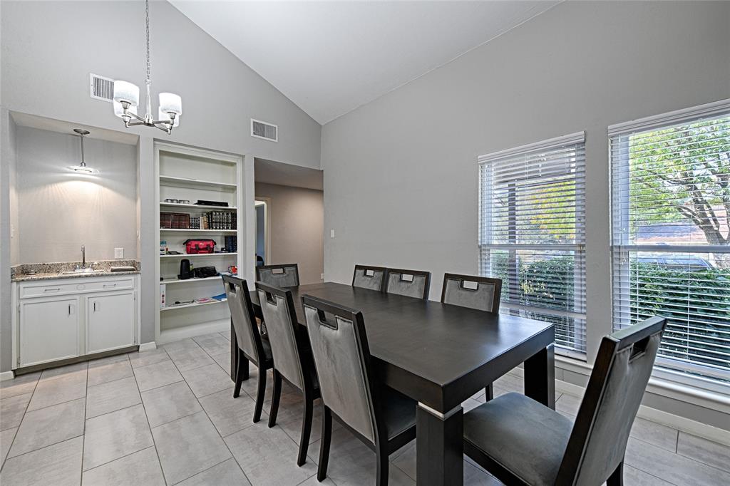 15632 Moondust Drive Dallas, TX 75248 - Photo 10 of 36 a view of a dining room with furniture and a chandelier