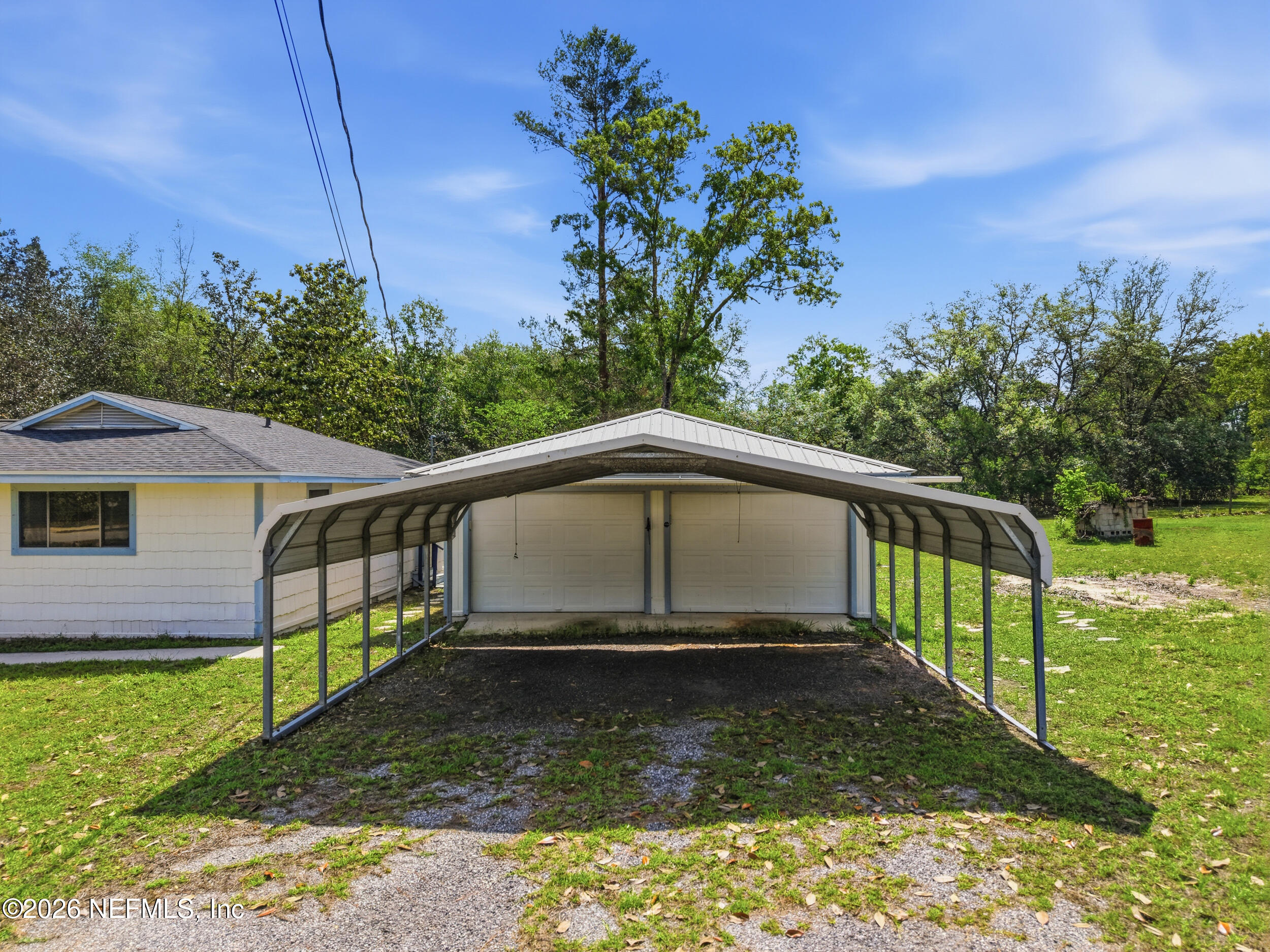 7593 Silver Sands Road Keystone Heights, FL 32656 - Photo 29 of 36 a house with trees in the background