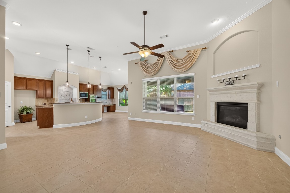 21331 Winding Path Way Richmond, TX 77406 - Photo 11 of 42 a view of a kitchen with furniture and a fireplace