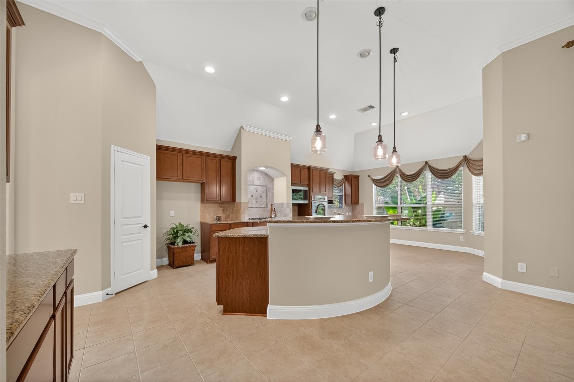 21331 Winding Path Way Richmond, TX 77406 - Photo 13 of 42 a view of kitchen with stainless steel appliances kitchen island granite countertop a stove a sink a refrigerator and a dining table