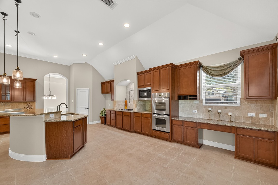 21331 Winding Path Way Richmond, TX 77406 - Photo 16 of 42 a large kitchen with stainless steel appliances lots of counter top space