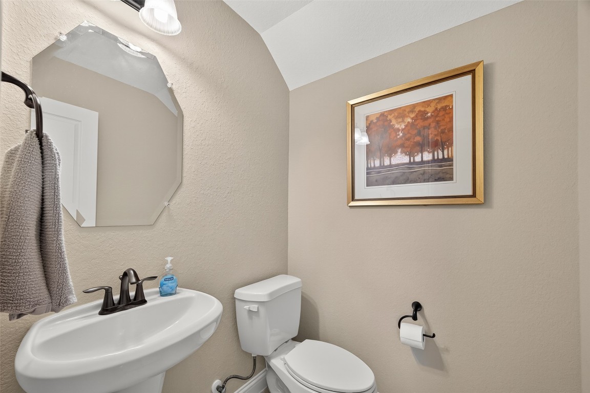 21331 Winding Path Way Richmond, TX 77406 - Photo 27 of 42 a bathroom with a toilet sink and mirror