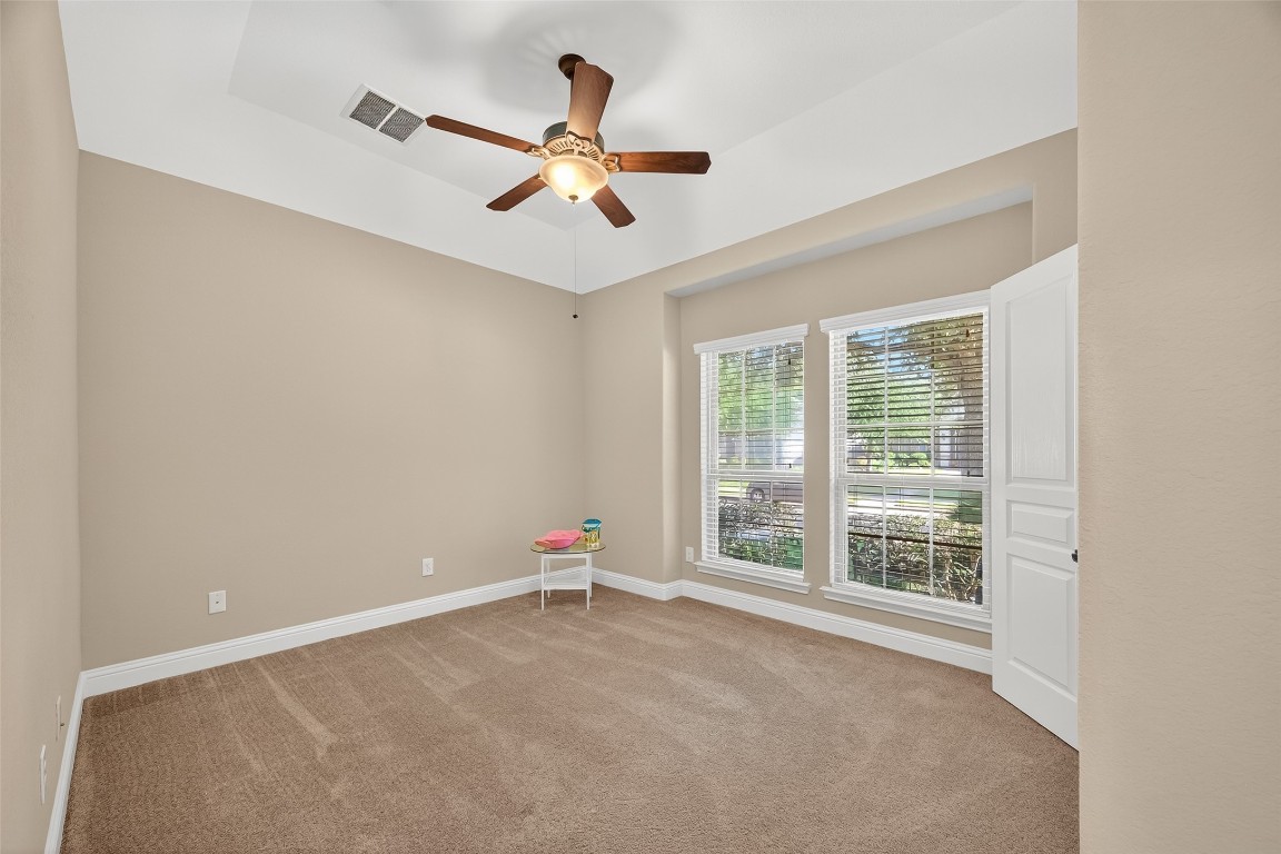 21331 Winding Path Way Richmond, TX 77406 - Photo 32 of 42 a view of a livingroom with a ceiling fan and window