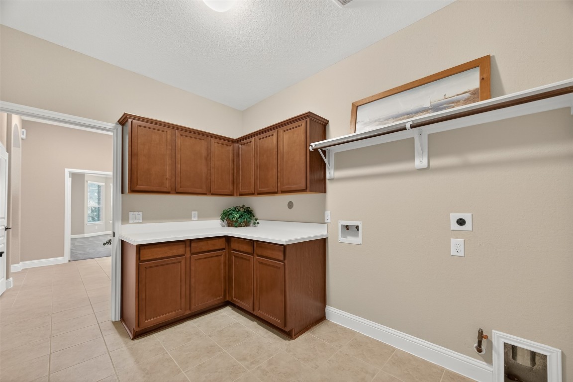 21331 Winding Path Way Richmond, TX 77406 - Photo 33 of 42 a room with a sink and cabinets