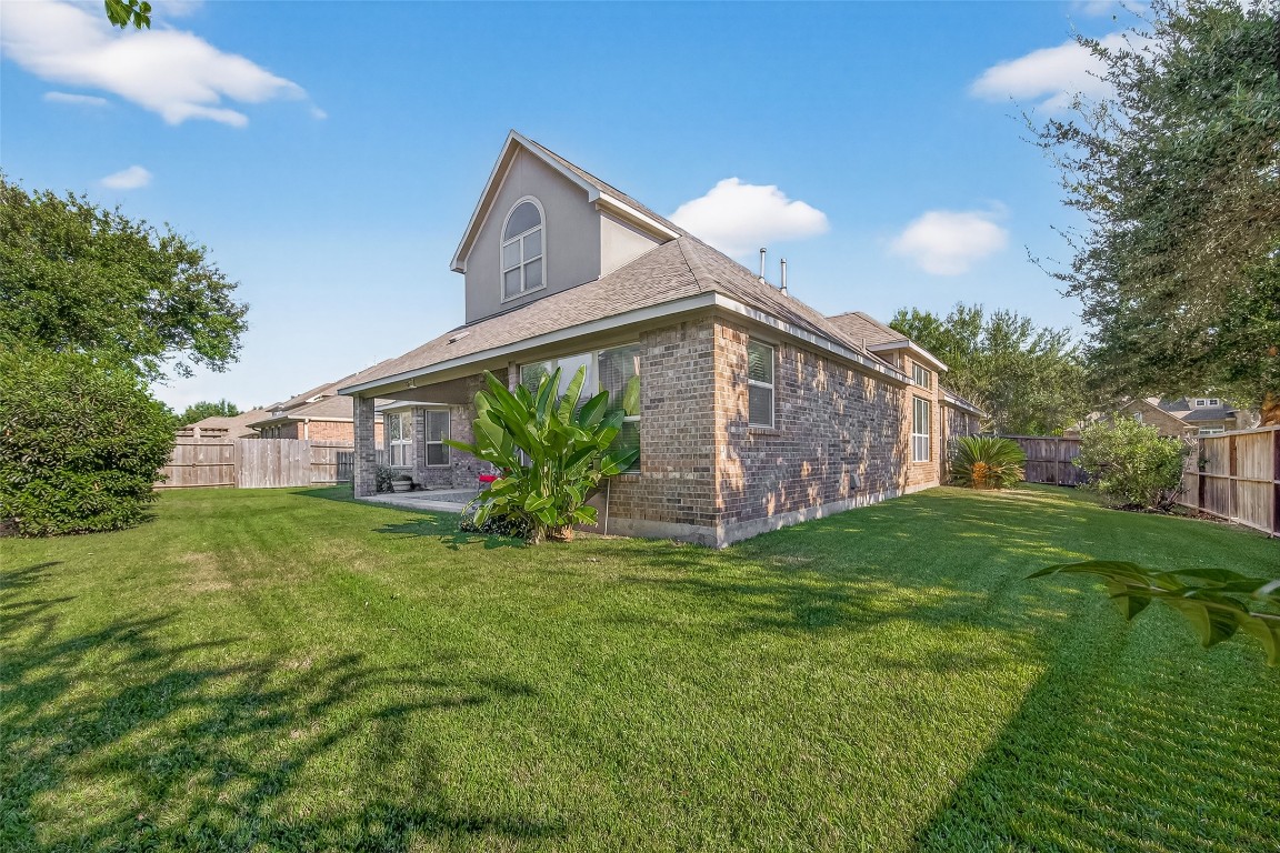 21331 Winding Path Way Richmond, TX 77406 - Photo 34 of 42 a view of a house with a yard