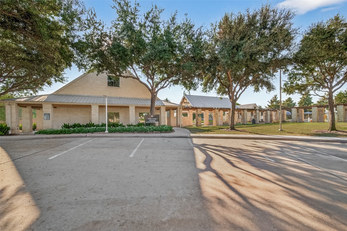 21331 Winding Path Way Richmond, TX 77406 - Photo 40 of 42 a front view of a house with a garden