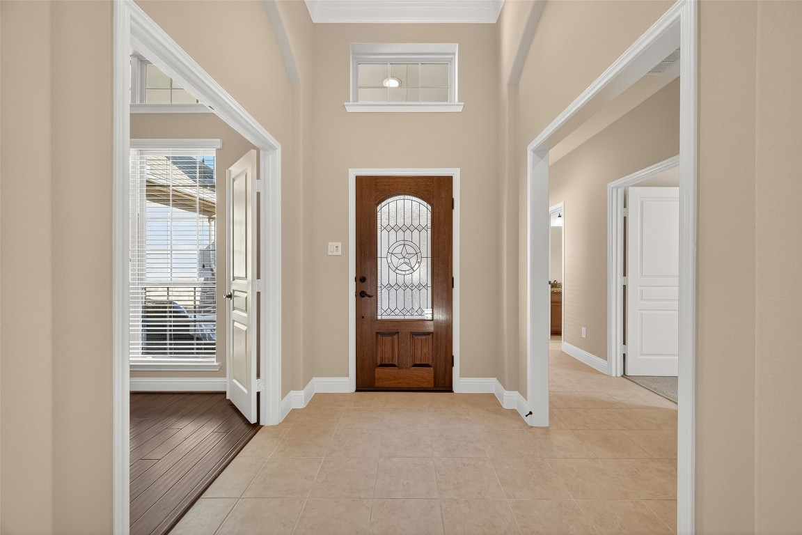 21331 Winding Path Way Richmond, TX 77406 - Photo 4 of 42 a view of a hallway with wooden floor and glass door