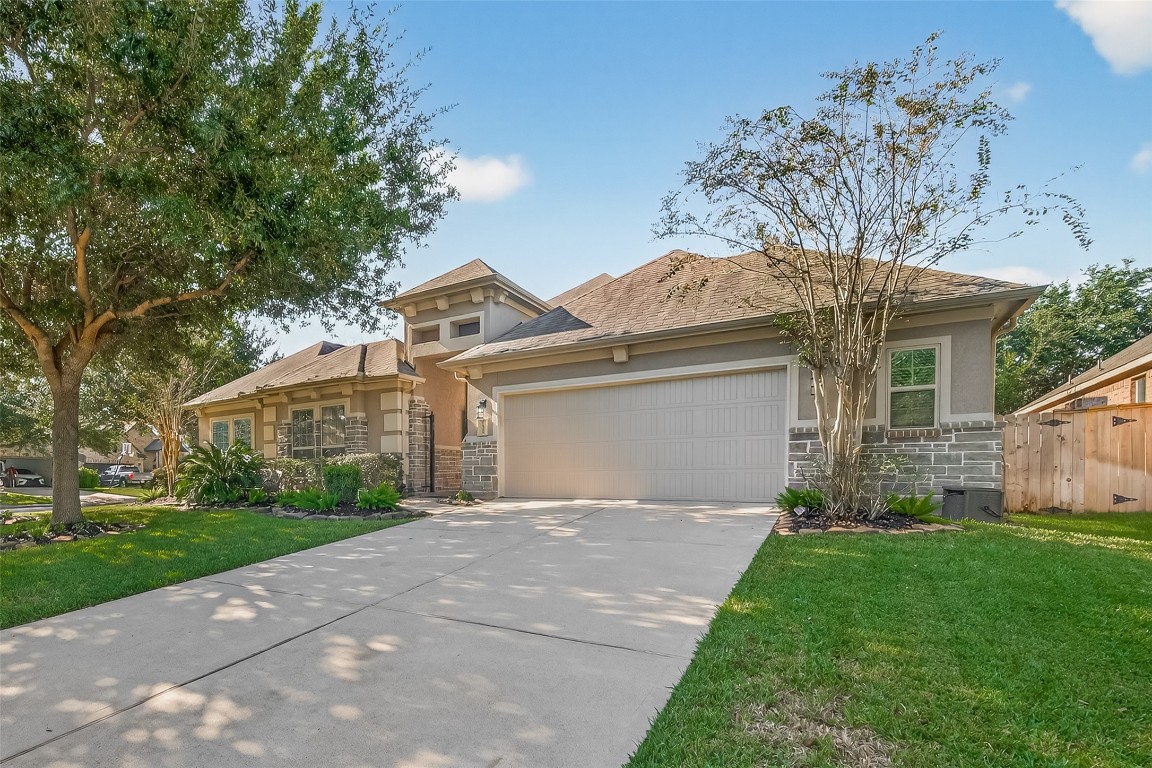 21331 Winding Path Way Richmond, TX 77406 - Photo 42 of 42 a front view of a house with a garden and yard