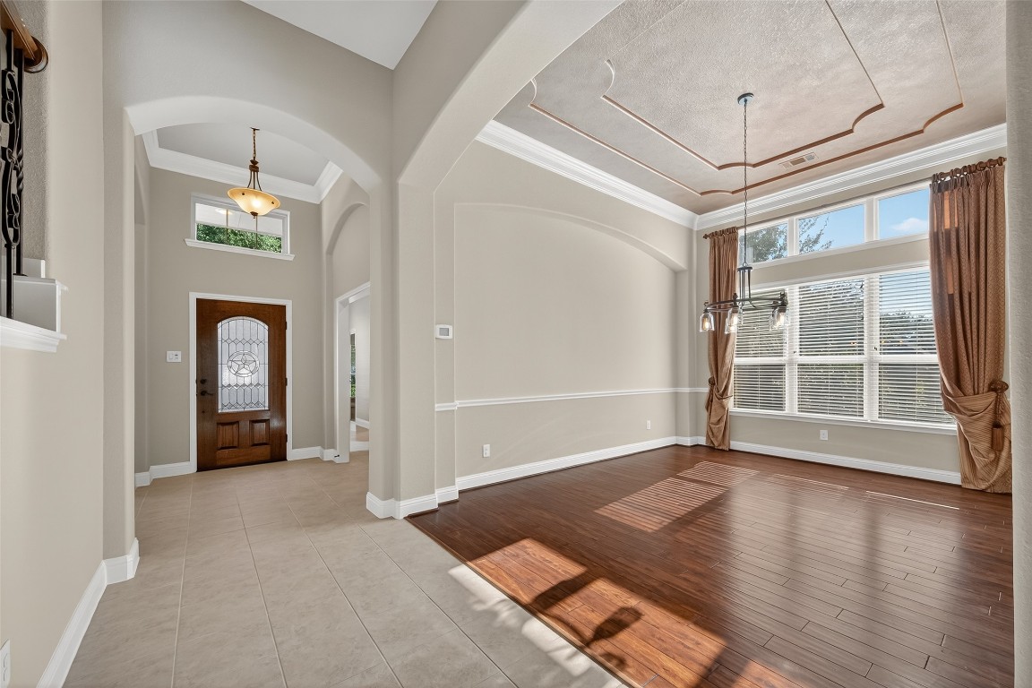 21331 Winding Path Way Richmond, TX 77406 - Photo 7 of 42 wooden floor in an empty room with a window