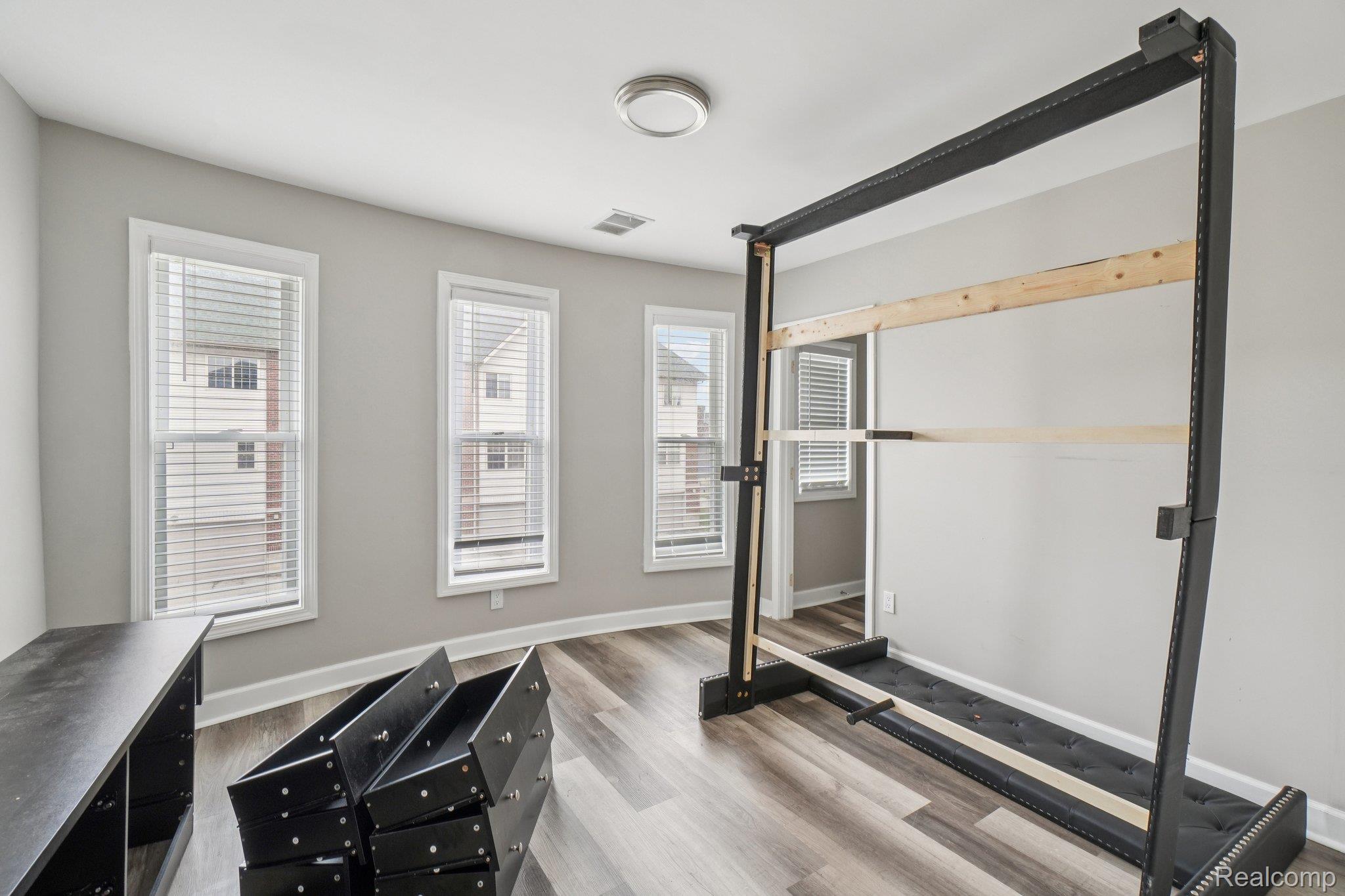 3822 Wabash Street Detroit, MI 48208 - Photo 16 of 17 Workout room featuring light wood-style flooring and baseboards