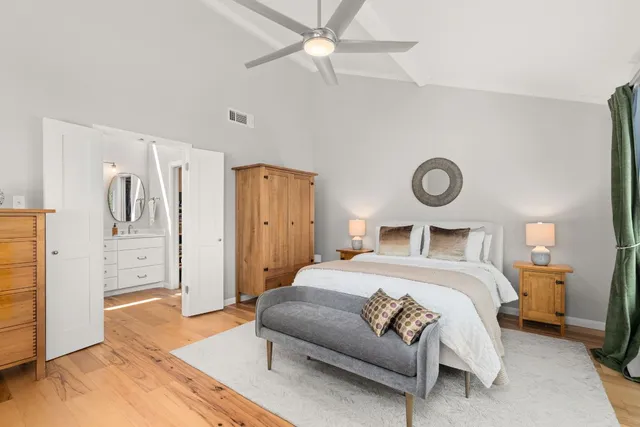 a bathroom with a toilet a sink and shower