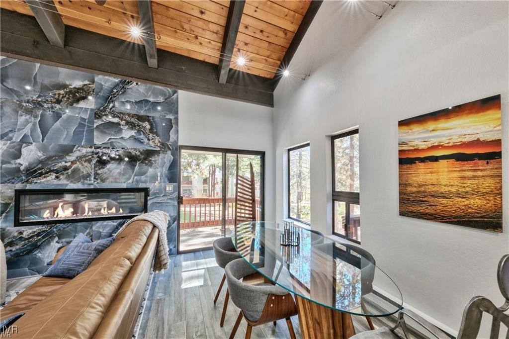 807 Alder Avenue, Unit 38 Incline Village, NV 89451 - Photo 2 of 15 a living room with furniture a flat screen tv and a floor to ceiling window