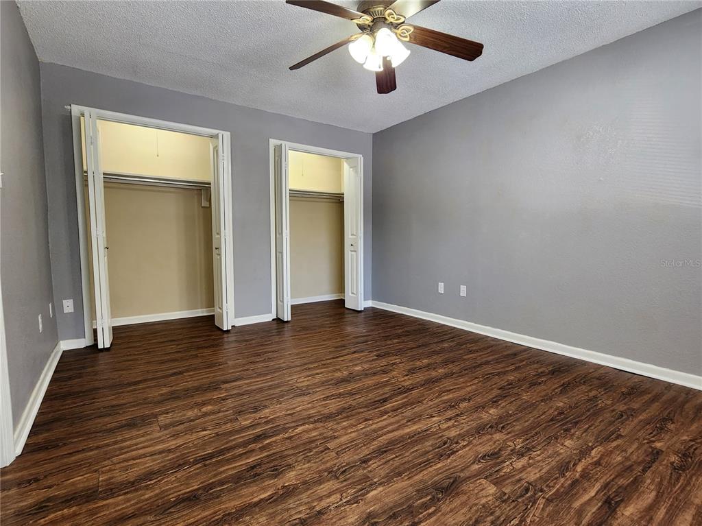 507 Northwest 39th Road, Unit 237 Gainesville, FL 32607 - Photo 11 of 21 a view of an empty room with wooden floor and a window