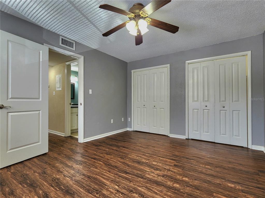 507 Northwest 39th Road, Unit 237 Gainesville, FL 32607 - Photo 12 of 21 a view of an empty room and wooden floor