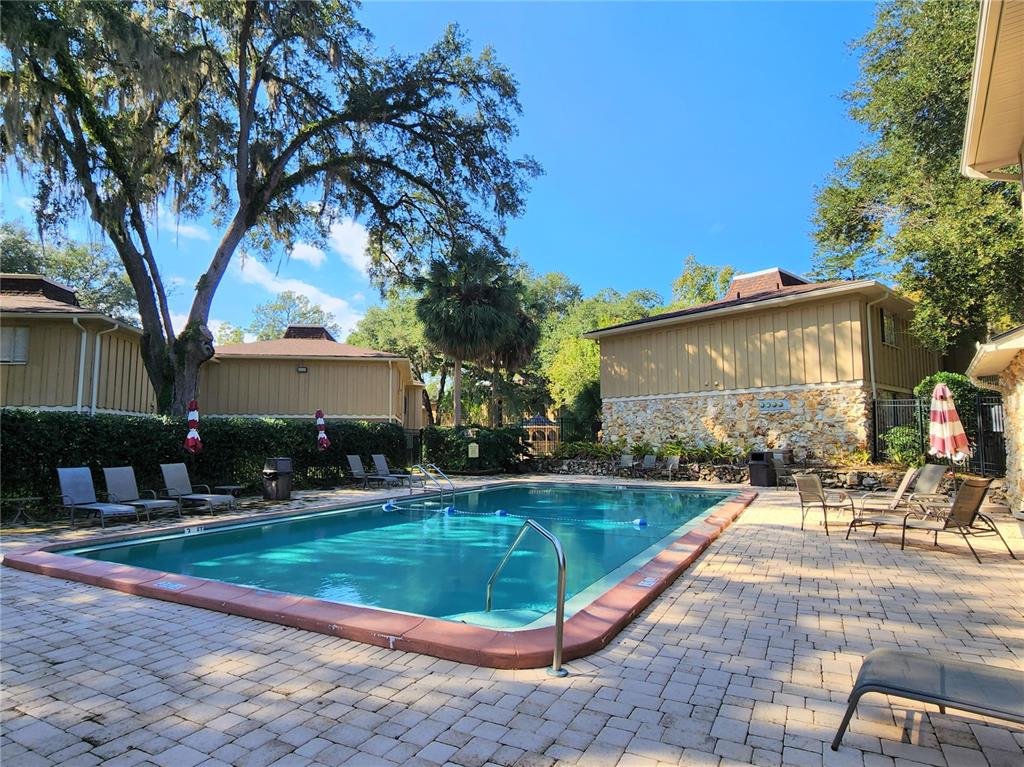 507 Northwest 39th Road, Unit 237 Gainesville, FL 32607 - Photo 16 of 21 a view of a house with swimming pool