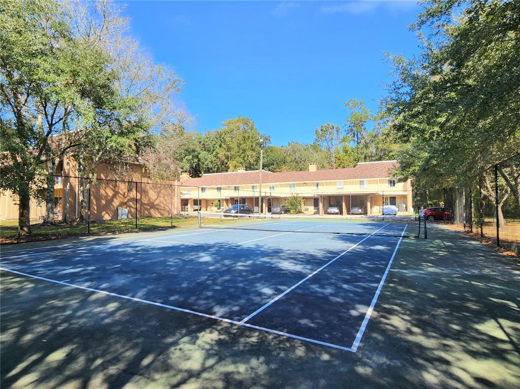 507 Northwest 39th Road, Unit 237 Gainesville, FL 32607 - Photo 19 of 21 a view of a swimming pool with an outdoor space and seating area