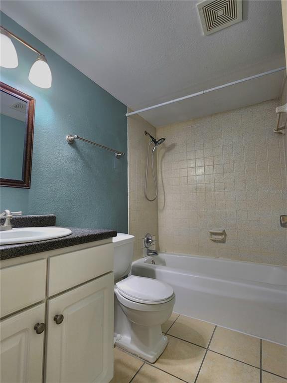 507 Northwest 39th Road, Unit 237 Gainesville, FL 32607 - Photo 9 of 21 a bathroom with a toilet a sink and shower