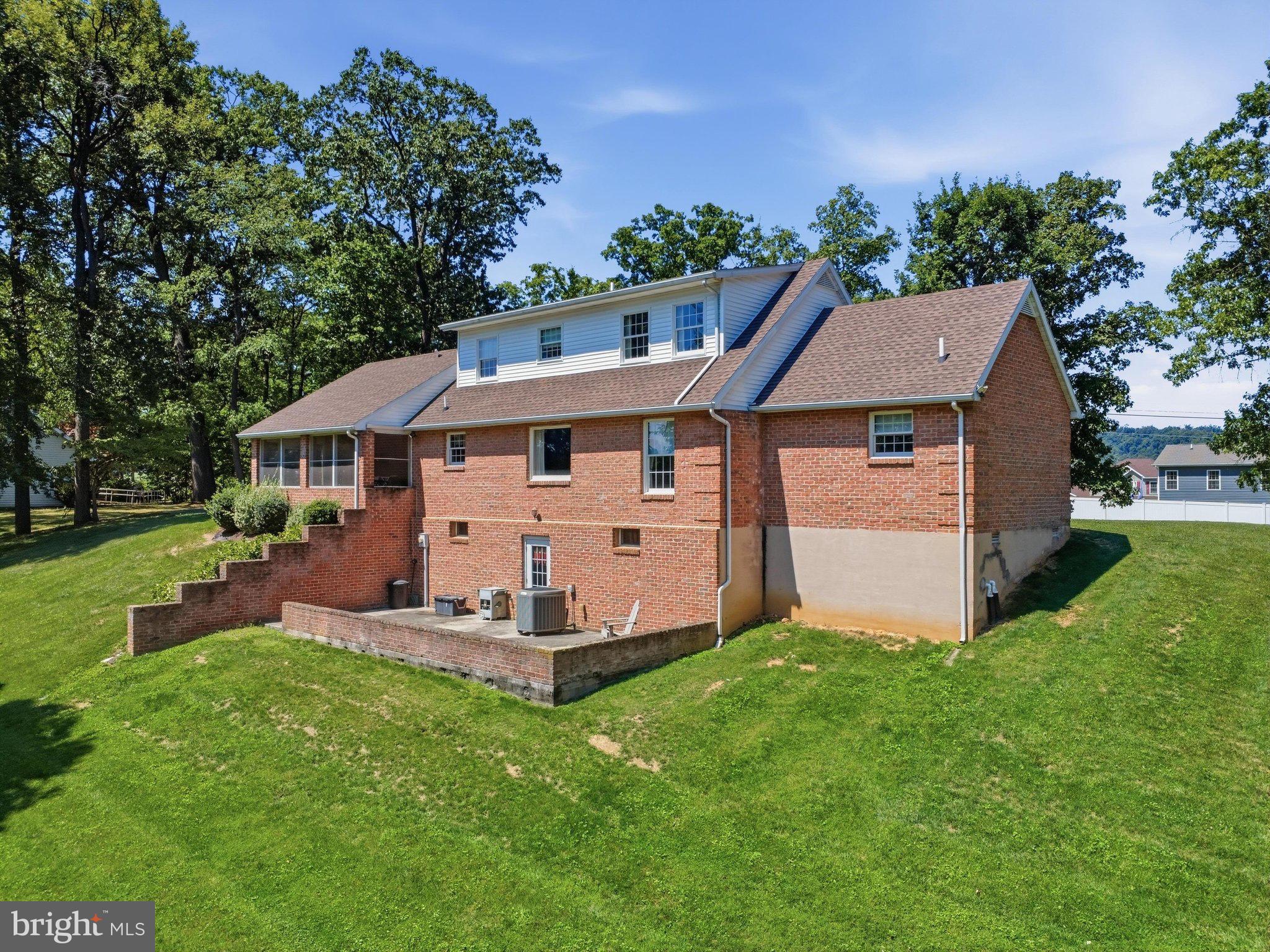 2606 Ridge Road South Martinsburg, WV 25403 - Photo 48 of 57 Charming brick home nestled in lush greenery.