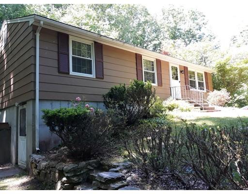144 Whitins Road Sutton, MA 01590 - Photo 1 of 19 a front view of a house with a yard