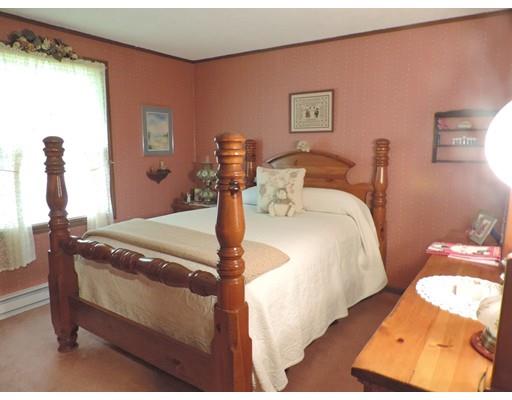 144 Whitins Road Sutton, MA 01590 - Photo 11 of 19 a bedroom with a bed and a mirror