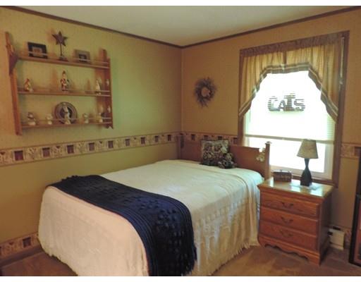 144 Whitins Road Sutton, MA 01590 - Photo 13 of 19 a bedroom with a bed and a night stand