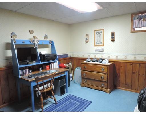 144 Whitins Road Sutton, MA 01590 - Photo 15 of 19 a room with furniture and a flat screen tv