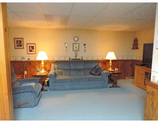 144 Whitins Road Sutton, MA 01590 - Photo 16 of 19 a living room with furniture and a flat screen tv