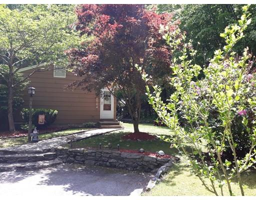 144 Whitins Road Sutton, MA 01590 - Photo 19 of 19 a backyard of a house with lots of green space
