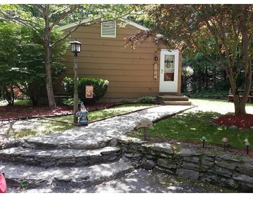 144 Whitins Road Sutton, MA 01590 - Photo 2 of 19 a view of a house with a yard tree and a yard