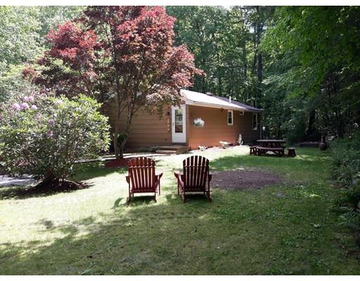 144 Whitins Road Sutton, MA 01590 - Photo 3 of 19 a front view of a house with a yard