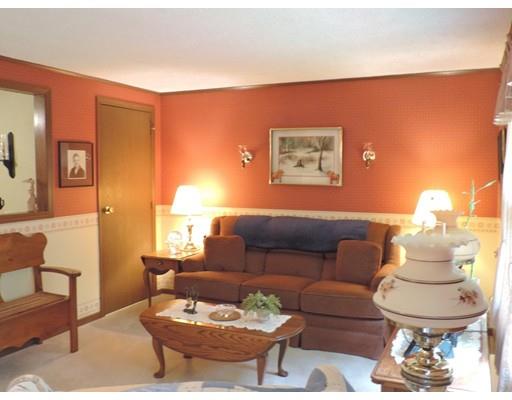 144 Whitins Road Sutton, MA 01590 - Photo 5 of 19 a living room with furniture and a lamp