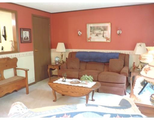 144 Whitins Road Sutton, MA 01590 - Photo 6 of 19 a living room with furniture and a table