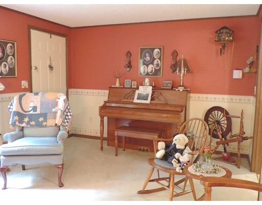 144 Whitins Road Sutton, MA 01590 - Photo 7 of 19 a living room with furniture and a table
