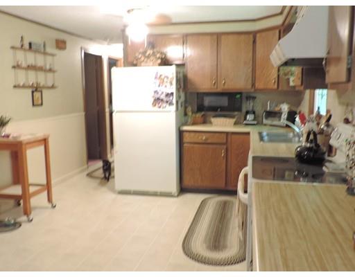 144 Whitins Road Sutton, MA 01590 - Photo 8 of 19 a kitchen with a refrigerator and a sink