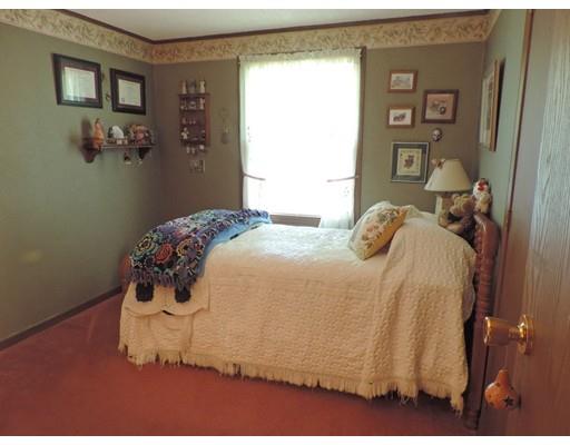 144 Whitins Road Sutton, MA 01590 - Photo 10 of 19 a bedroom with a bed and closet