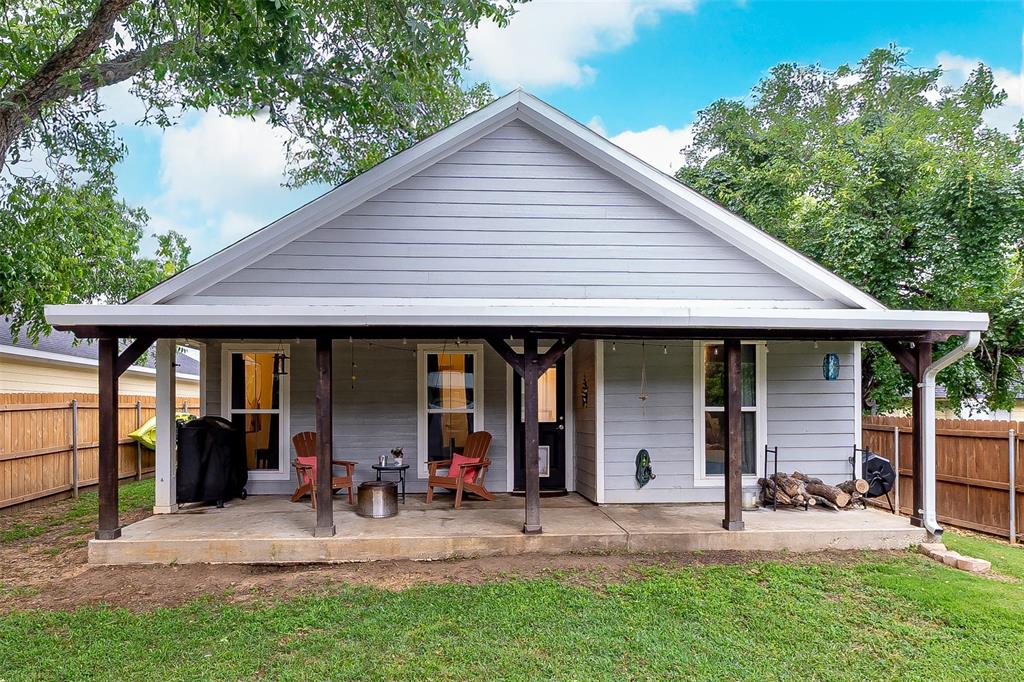 161 Columbia Street Cleburne, TX 76031 - Photo 17 of 19 a view of a house with backyard porch and sitting area