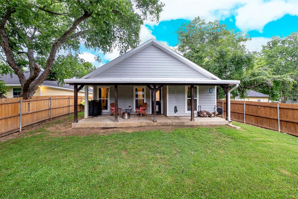 161 Columbia Street Cleburne, TX 76031 - Photo 18 of 19 a view of a house with a yard and sitting area