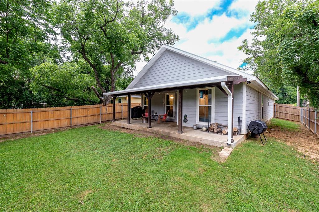 161 Columbia Street Cleburne, TX 76031 - Photo 19 of 19 a view of a house with backyard and sitting area