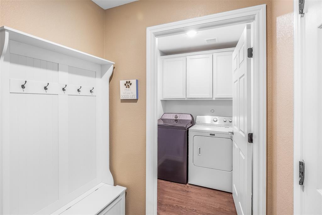 161 Columbia Street Cleburne, TX 76031 - Photo 8 of 19 a view of storage and utility room with washer and dryer