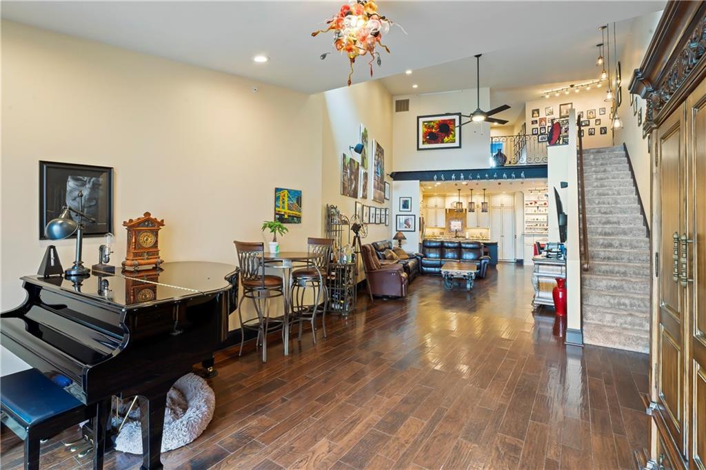 4119 Butler Street Pittsburgh, PA 15201 - Photo 11 of 23 a living room with dining room and wooden floor