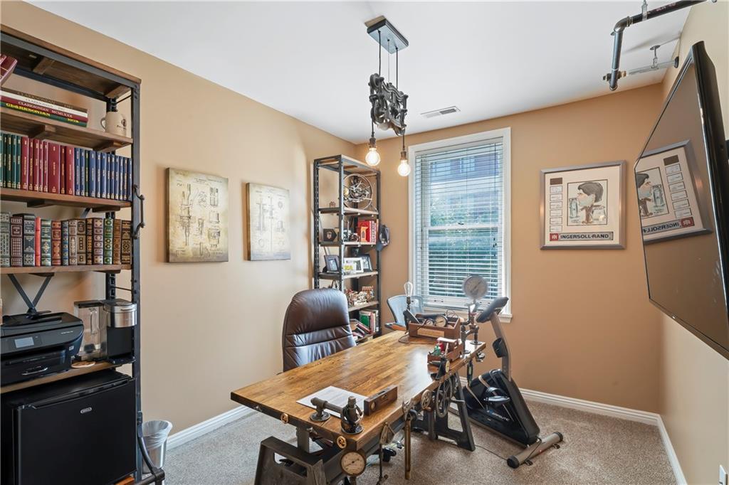 4119 Butler Street Pittsburgh, PA 15201 - Photo 15 of 23 a view of a workspace with furniture and a window