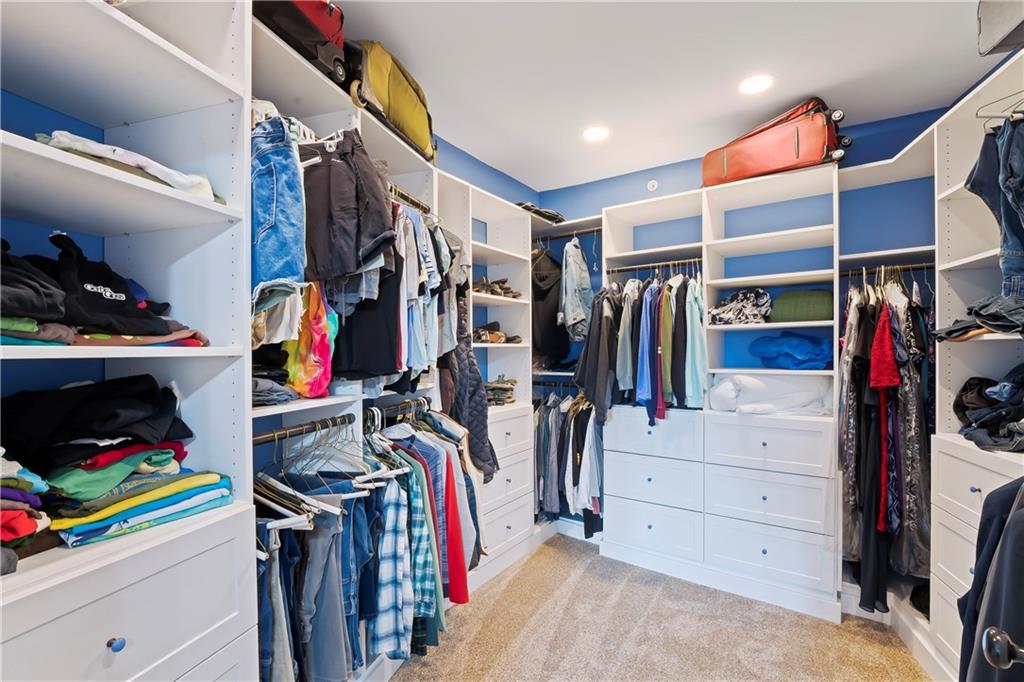 4119 Butler Street Pittsburgh, PA 15201 - Photo 20 of 23 a view of walk in closet with clothes and shoes