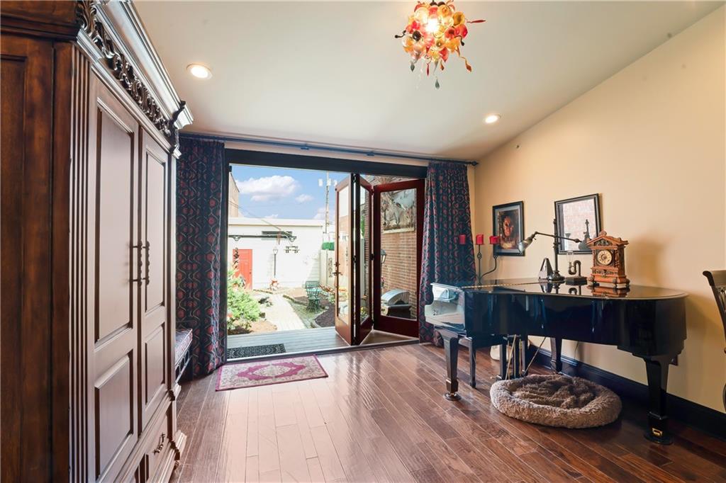 4119 Butler Street Pittsburgh, PA 15201 - Photo 5 of 23 a view of a livingroom with furniture window and wooden floor